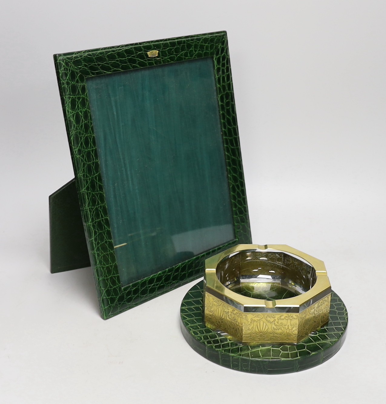 An Asprey green faux crocodile hide desk set, comprising photograph frame, 32 cm high and Moser glass ashtray